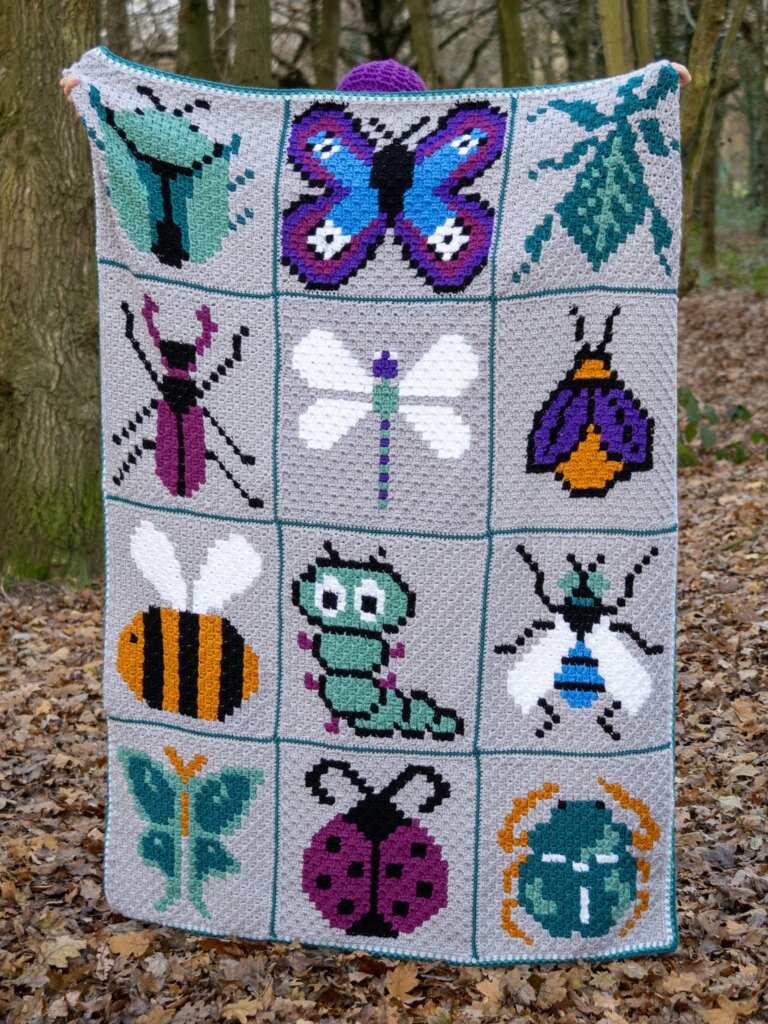 Crochet pixel art bug blanket