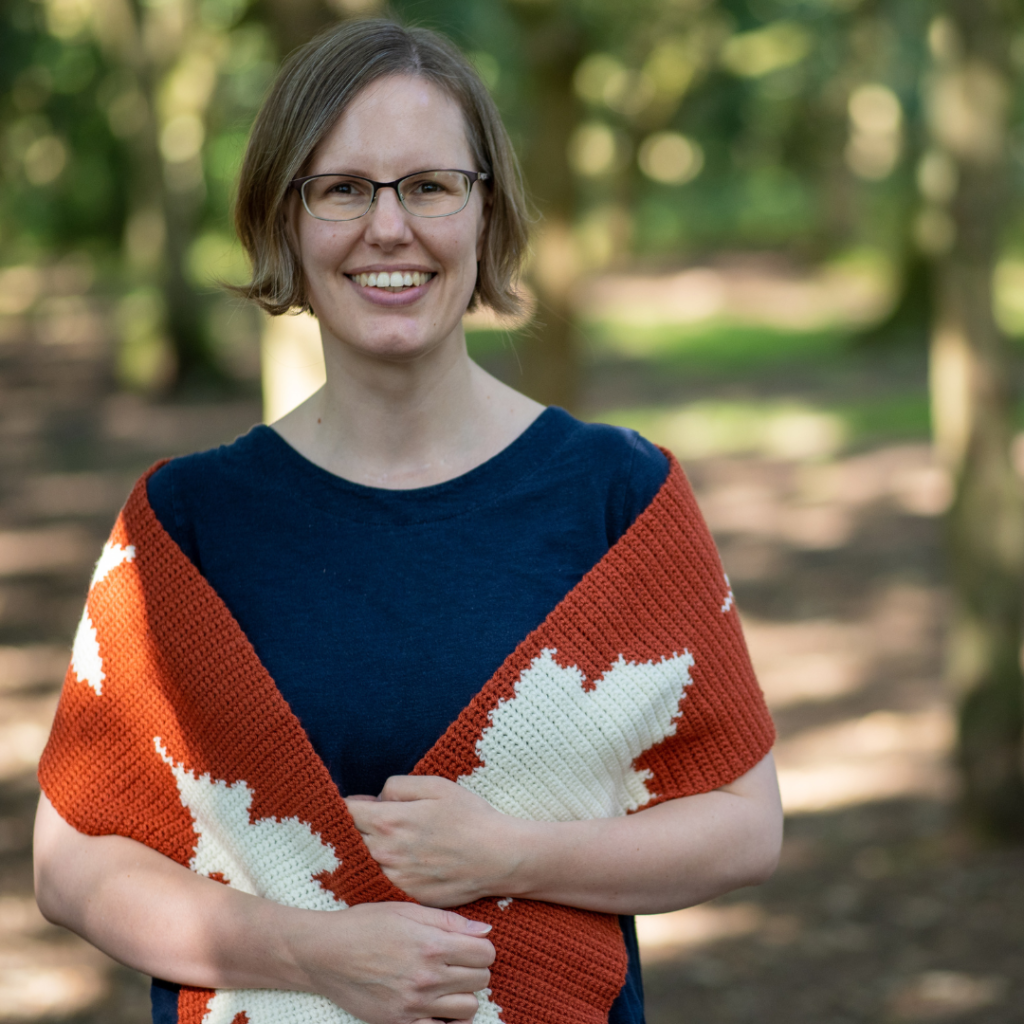 Smiling woman crochet shawl